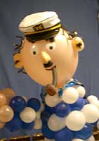 Six foot tall Balloonatics balloon sculpture of a loveable seaman complete with seaman's hat and pipe