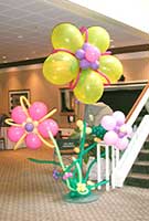 Balloonatics fantasy flower balloon sculptures stand 8 feet tall and brighten any event.  We construct them in colors to match your decor theme.
