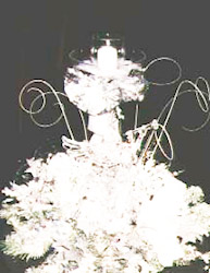This glitzy mylar centrpiece candle holding centerpiece puts sparkle on guest tables