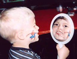 boy enjoying face painting